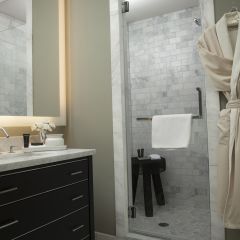 bathroom with robe hanging on door